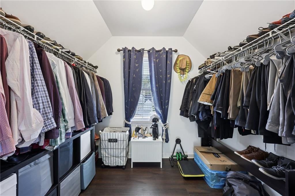 704 Highland Ridge Pointe Lawrenceville, GA 30045 - Photo 20 of 36 a view of walk in closet with clothes and shoes