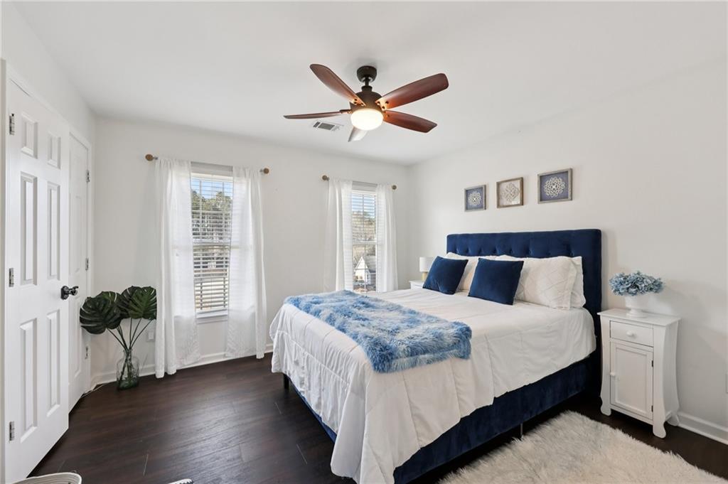704 Highland Ridge Pointe Lawrenceville, GA 30045 - Photo 22 of 36 a bedroom with a bed and a window