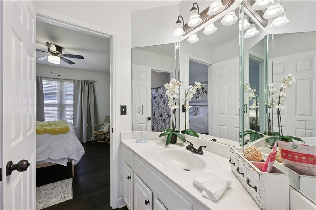 704 Highland Ridge Pointe Lawrenceville, GA 30045 - Photo 23 of 36 a bathroom with a sink double vanity and mirror