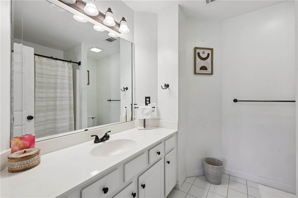 704 Highland Ridge Pointe Lawrenceville, GA 30045 - Photo 27 of 36 a bathroom with a double vanity sink mirror and toilet