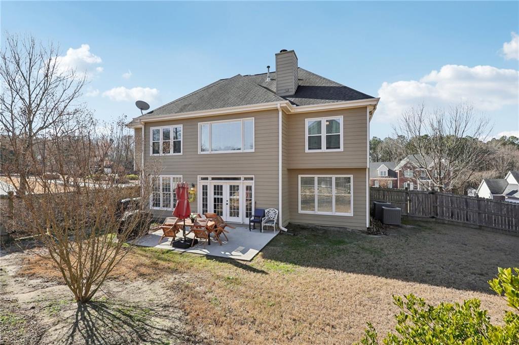 704 Highland Ridge Pointe Lawrenceville, GA 30045 - Photo 30 of 36 a front view of a house with garden
