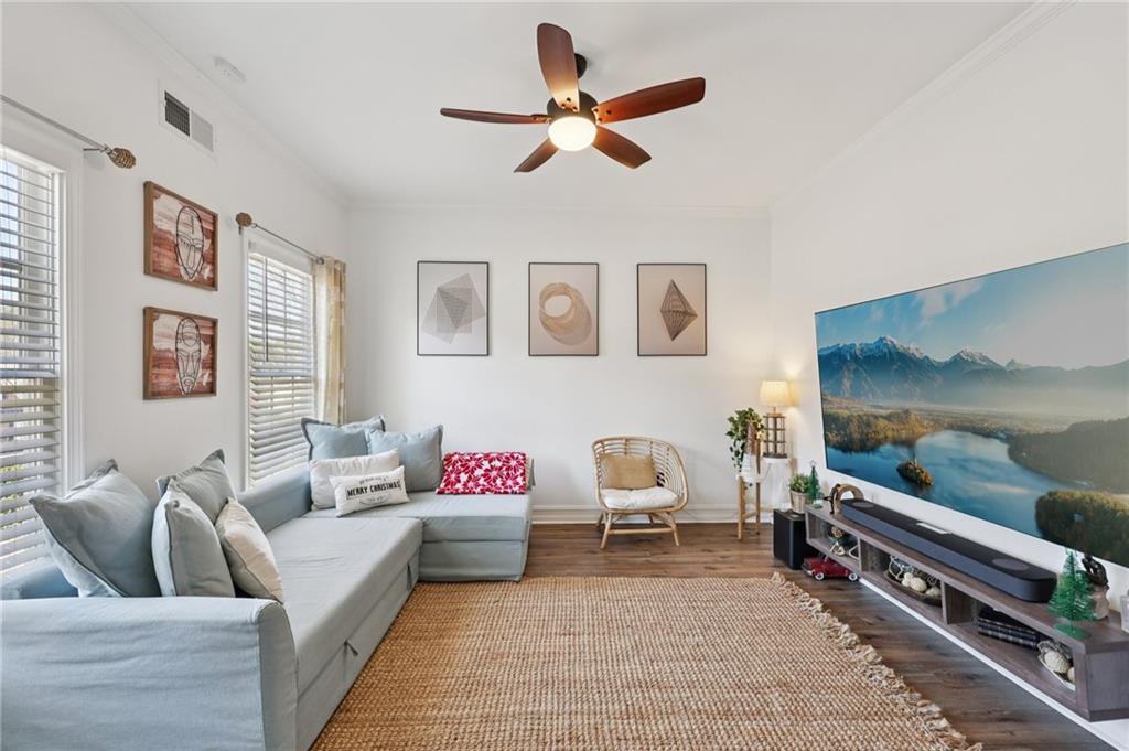 704 Highland Ridge Pointe Lawrenceville, GA 30045 - Photo 3 of 36 a living room with furniture and a flat screen tv