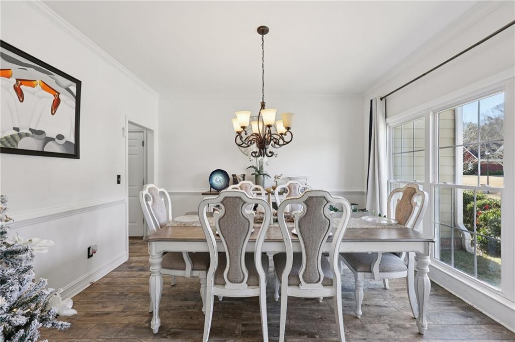 704 Highland Ridge Pointe Lawrenceville, GA 30045 - Photo 4 of 36 a view of a dining room with furniture window and wooden floor
