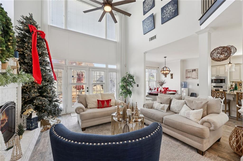 704 Highland Ridge Pointe Lawrenceville, GA 30045 - Photo 6 of 36 a living room with furniture and a potted plant