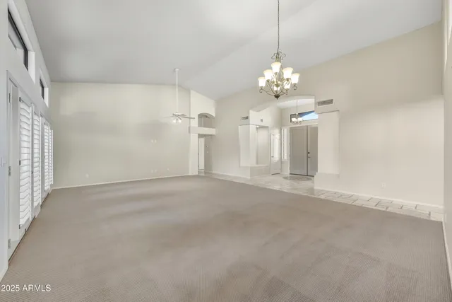 a view of a chandelier in big room and chandelier