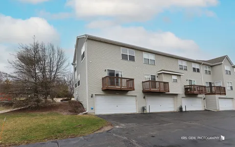 a view of a house with backyard and kitchen