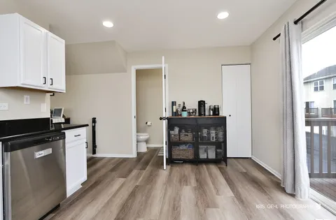 a kitchen with kitchen island a sink stove and refrigerator