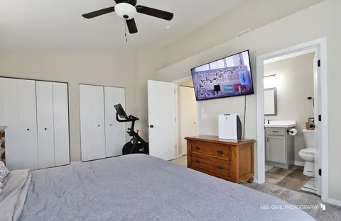 a bed room with a bed and a chandelier