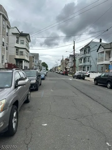 a view of street with parked cars