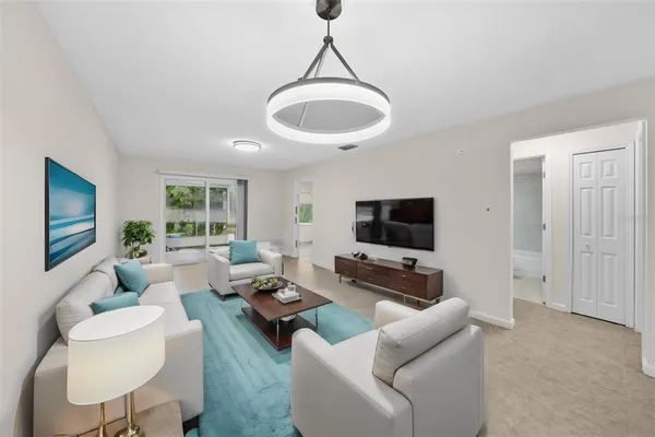 a living room with furniture and a flat screen tv