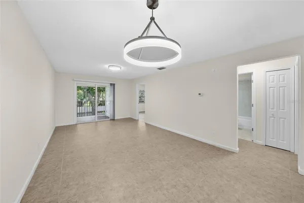a view of a room with a swimming pool and windows