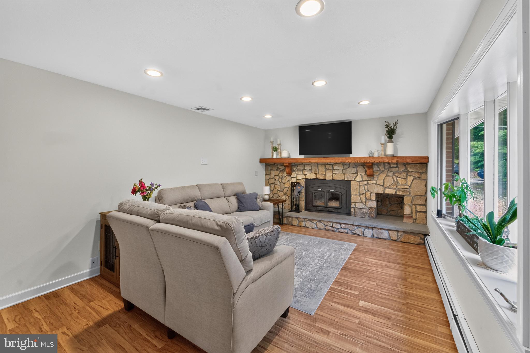 338 Woolf Road Milford, NJ 08848 - Photo 2 of 24 Cozy living space with stone fireplace.
