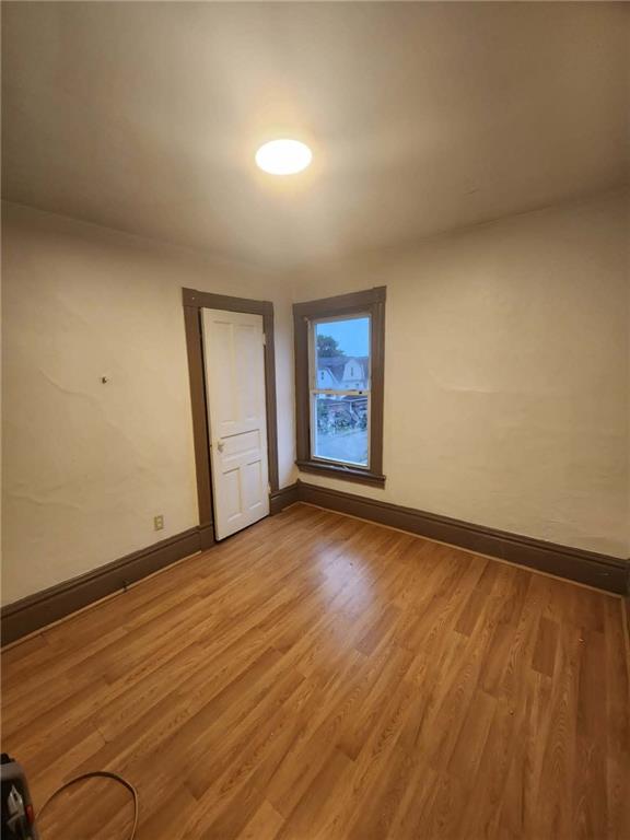 340 Virginia Avenue, Unit 3 Butler, PA 16001 - Photo 11 of 12 a view of an empty room with wooden floor and a window