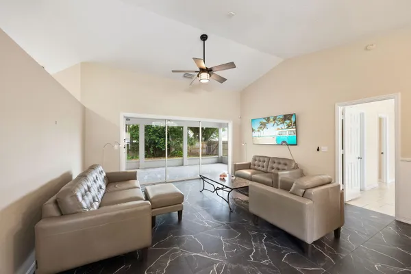 a living room with furniture and a window