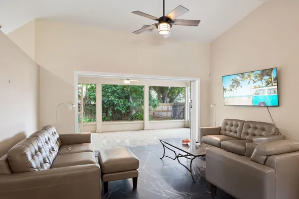 a living room with furniture and a large window