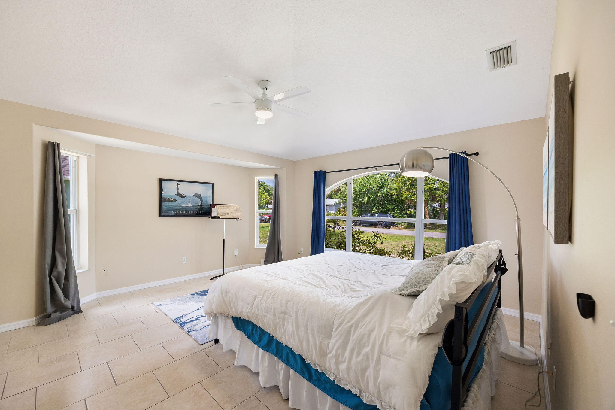 720 Bayfront Terrace Sebastian, FL 32958 - Photo 18 of 33 a bedroom with a large bed and a window