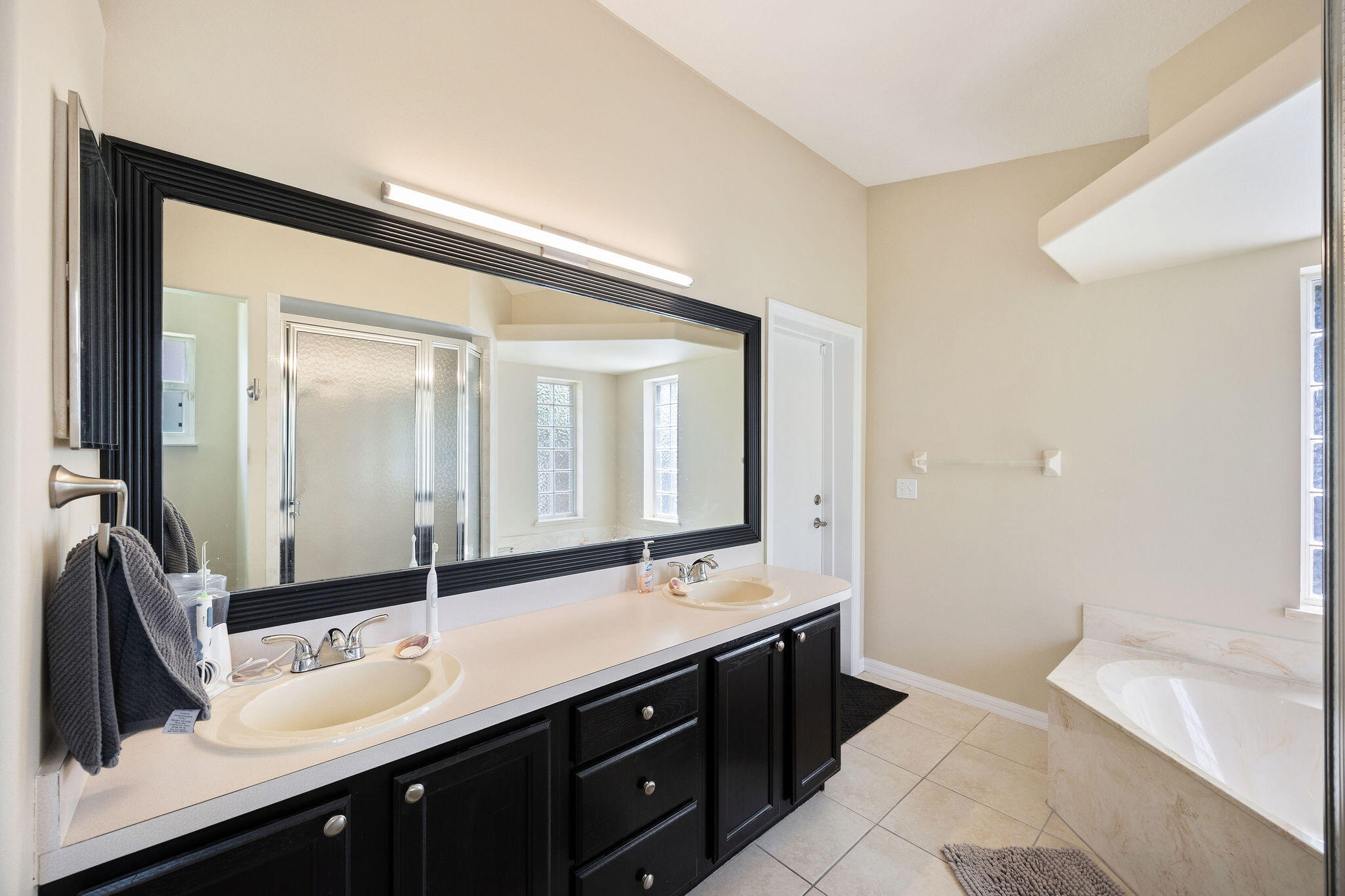 720 Bayfront Terrace Sebastian, FL 32958 - Photo 19 of 33 a bathroom with a double vanity sink mirror and double