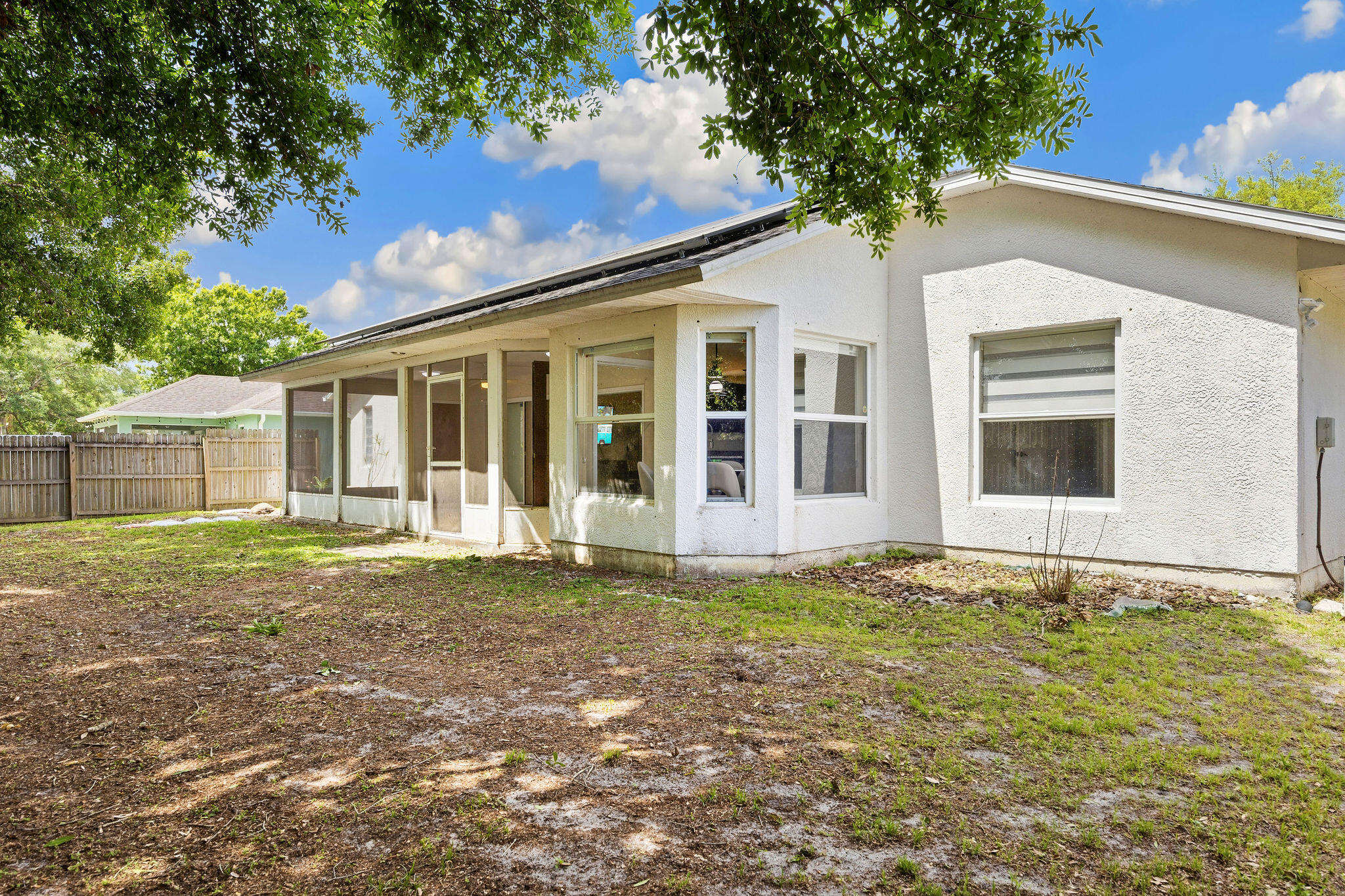 720 Bayfront Terrace Sebastian, FL 32958 - Photo 30 of 33 a view of a yard in front of a house with a large tree