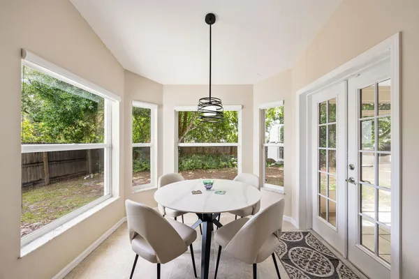a view of a dining room with furniture window and wooden floor