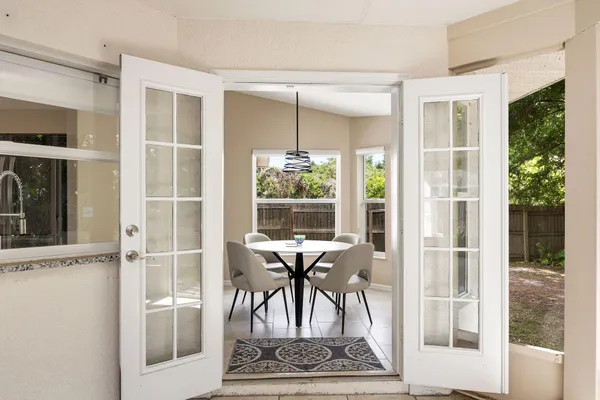 a view of a dining room with furniture window and outside view