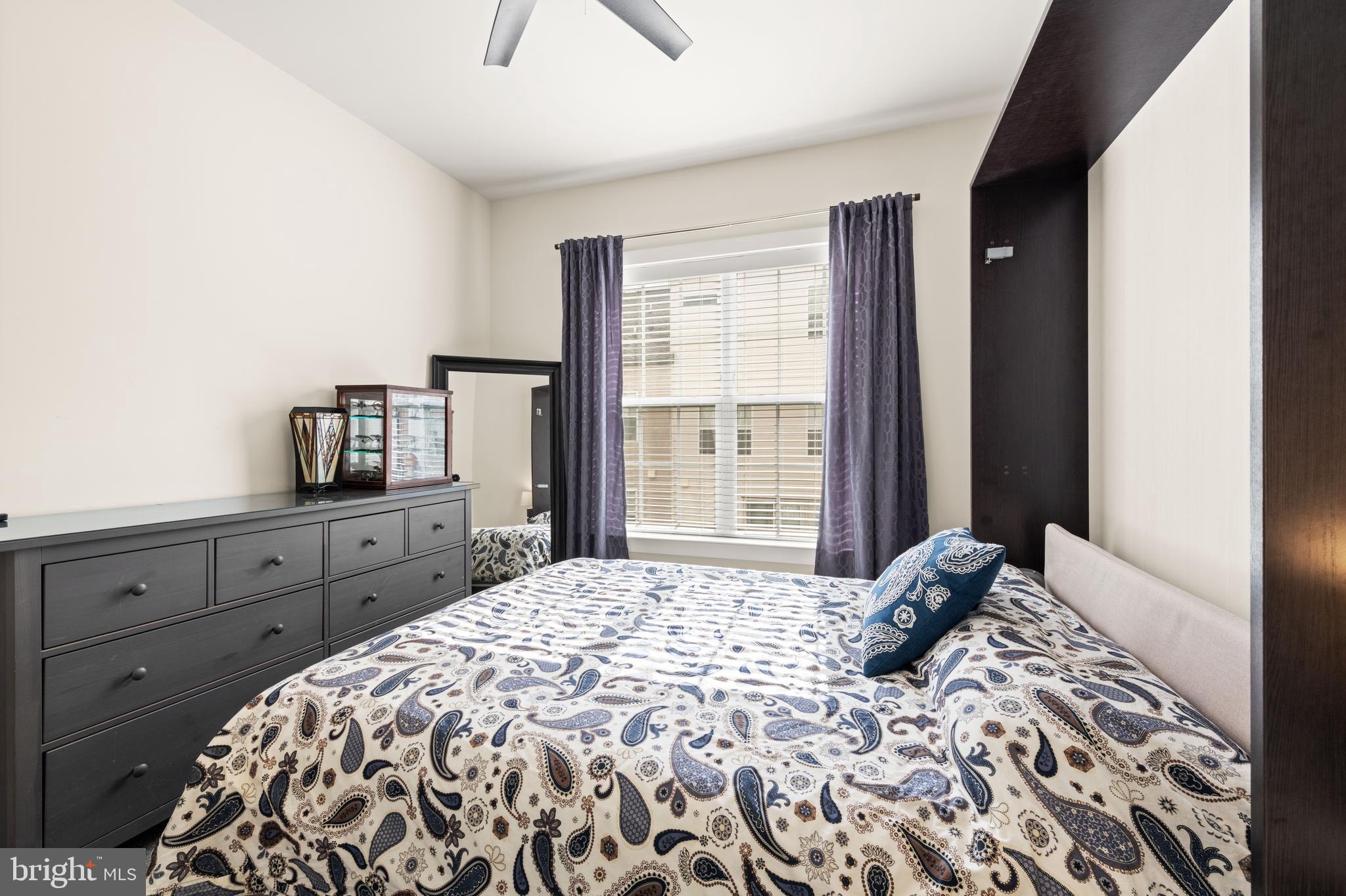 135 Klee Alley Silver Spring, MD 20906 - Photo 25 of 37 a bedroom with a large bed and a window