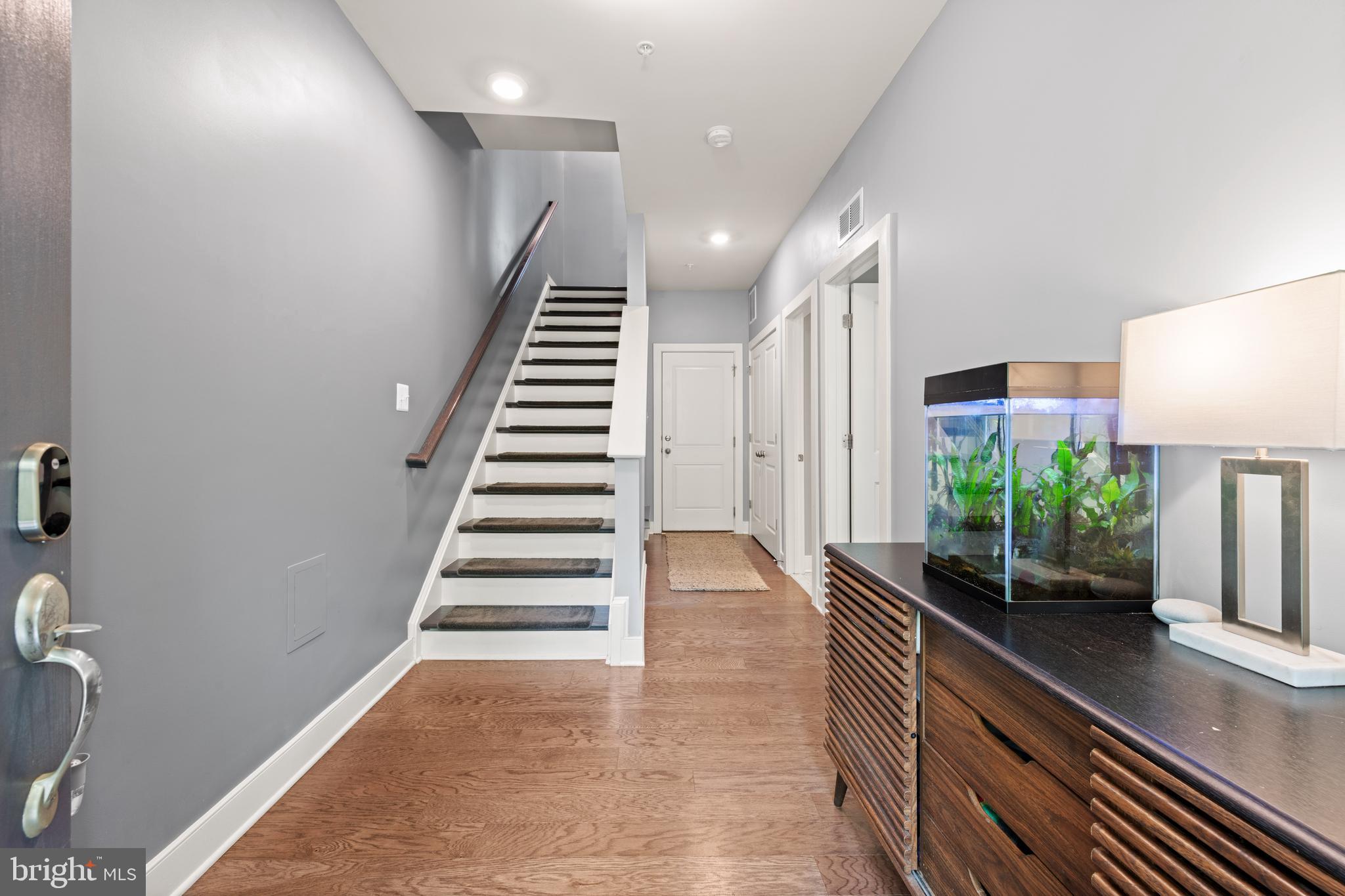 135 Klee Alley Silver Spring, MD 20906 - Photo 3 of 37 a view of entryway and hall with wooden floor
