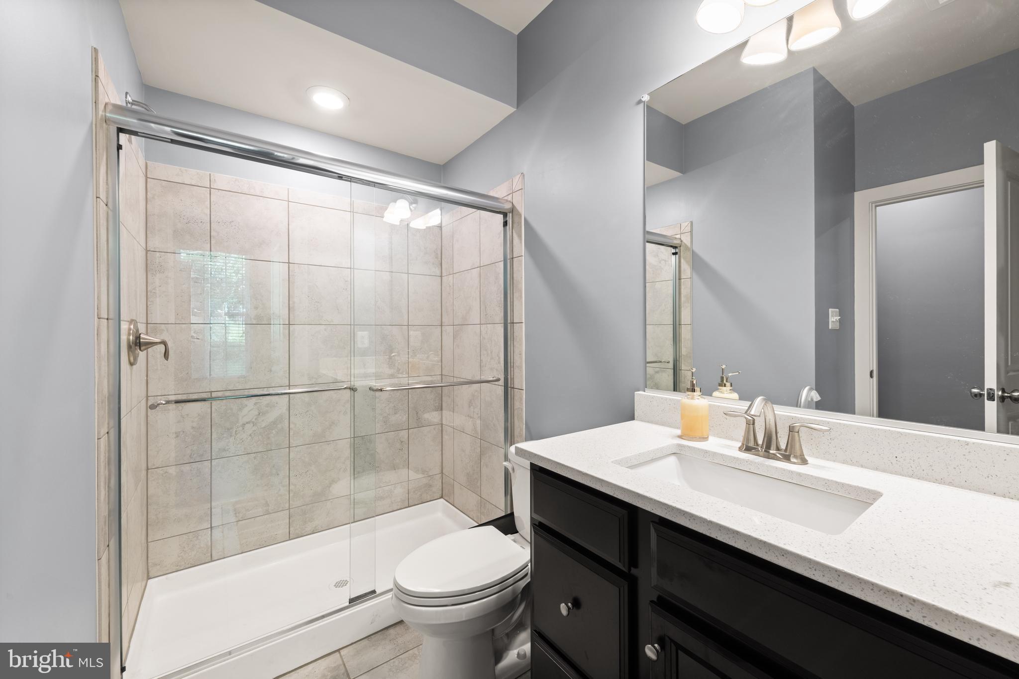 135 Klee Alley Silver Spring, MD 20906 - Photo 7 of 37 a bathroom with a sink a toilet and shower