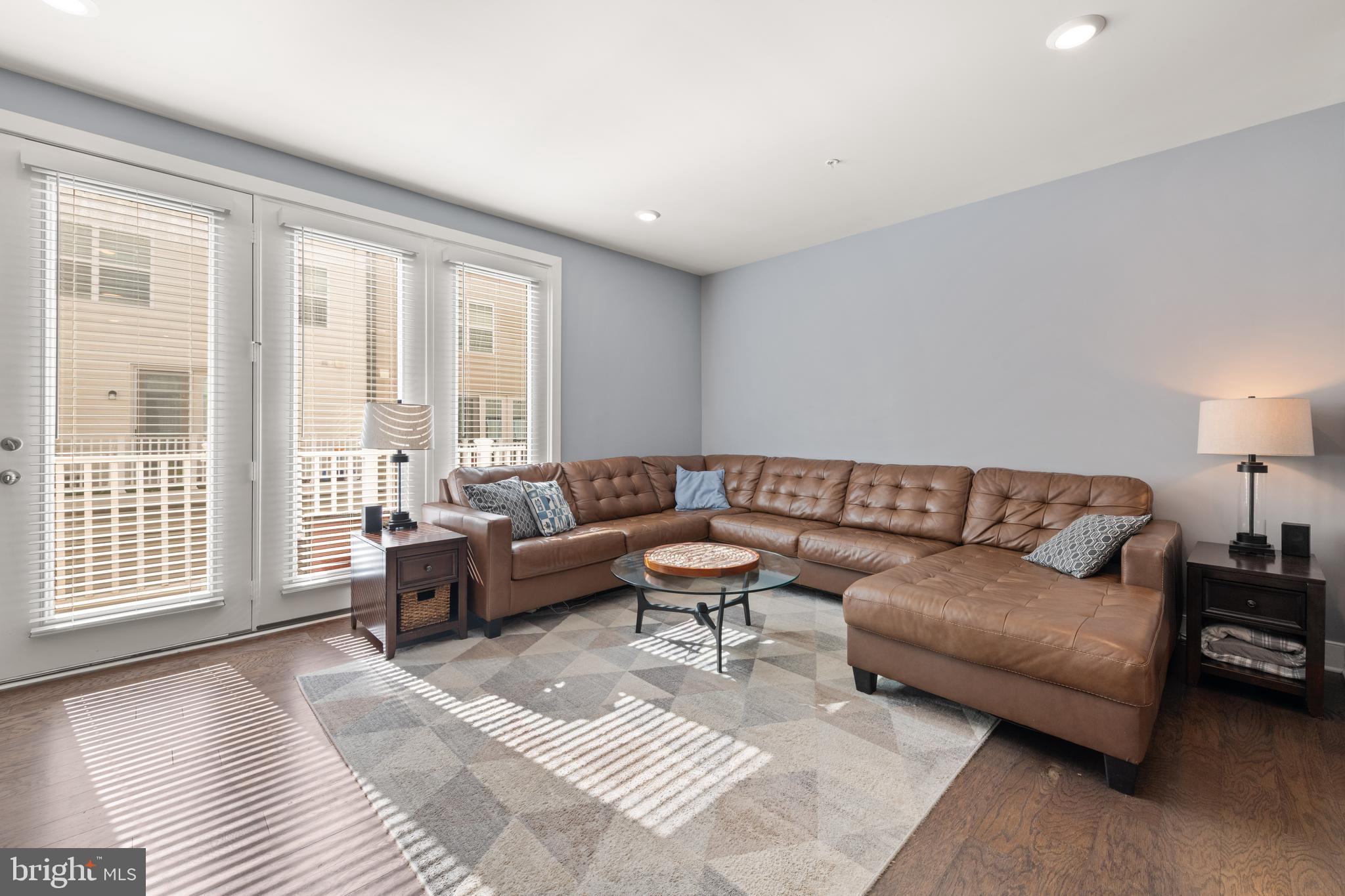 135 Klee Alley Silver Spring, MD 20906 - Photo 9 of 37 a living room with furniture and a large window