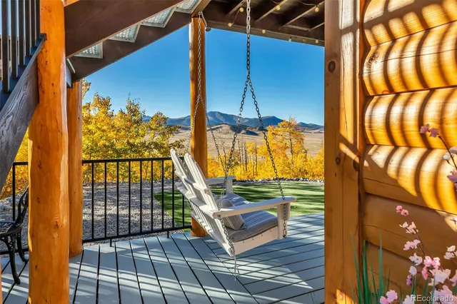 a kitchen with a table chairs and a wooden floor