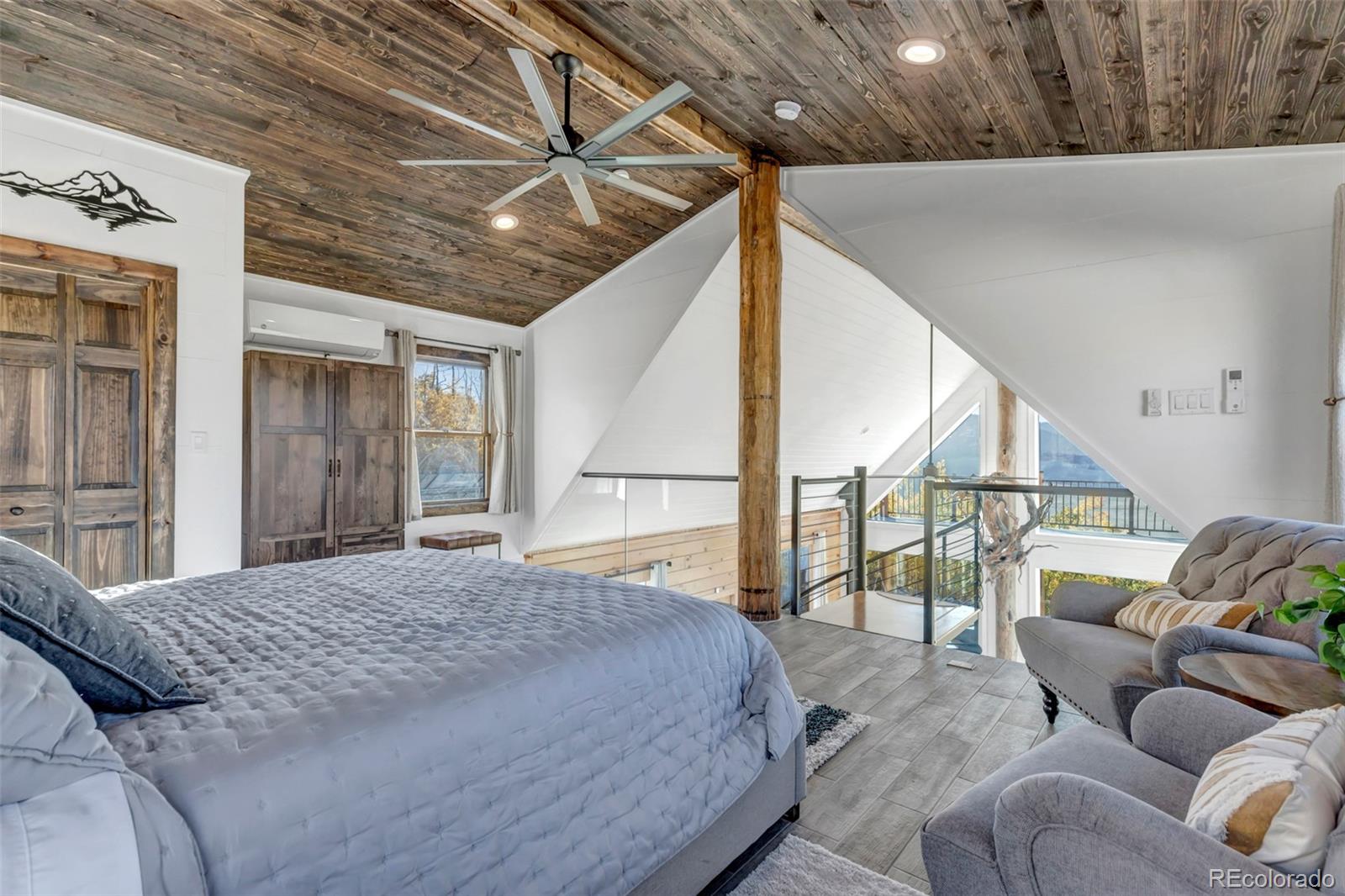 1023 Mexican Ridge Circle Como, CO 80432 - Photo 41 of 50 a bedroom with a bed couch and a window