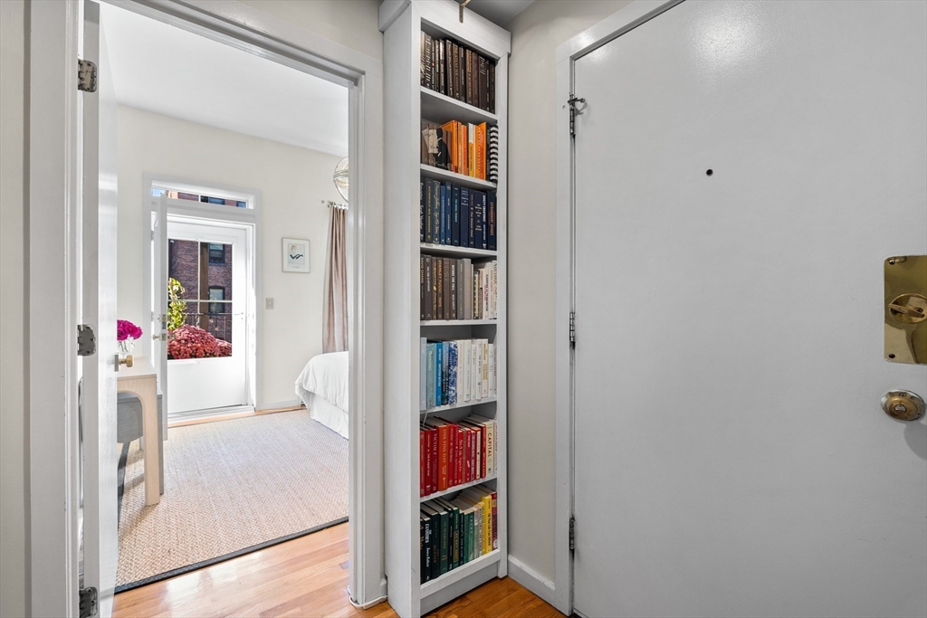 88 Worcester Street, Unit 4 Boston, MA 02118 - Photo 12 of 24 a living room with furniture and a book shelf