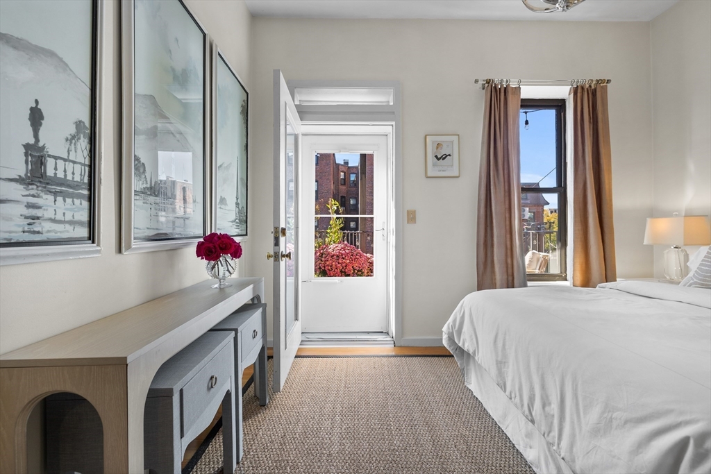 88 Worcester Street, Unit 4 Boston, MA 02118 - Photo 14 of 24 a bedroom with a bed and a window