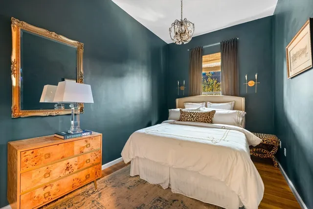 a bedroom with bed and window