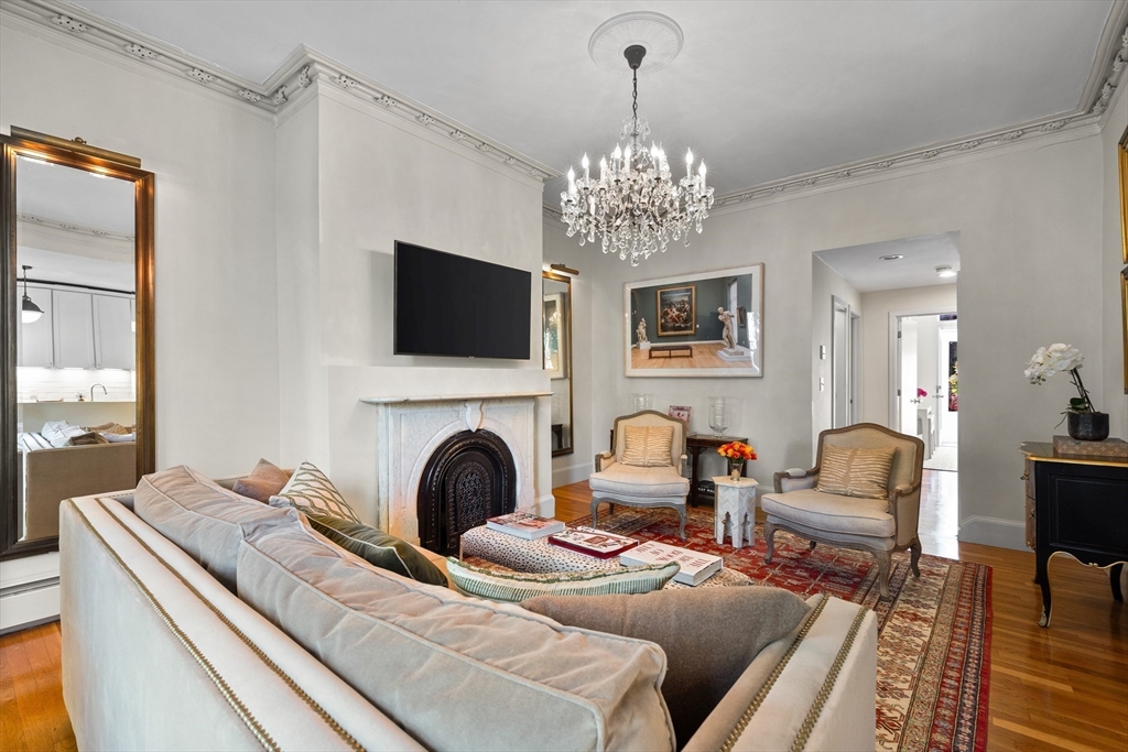 88 Worcester Street, Unit 4 Boston, MA 02118 - Photo 6 of 24 a living room with furniture a fireplace and a flat screen tv