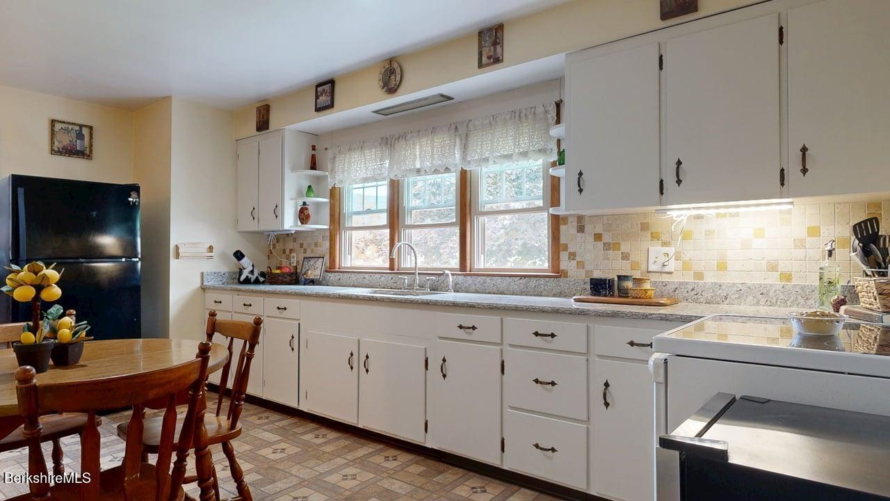 16 Anthony Street Adams, MA 01220 - Photo 12 of 33 a kitchen with white cabinets and sink
