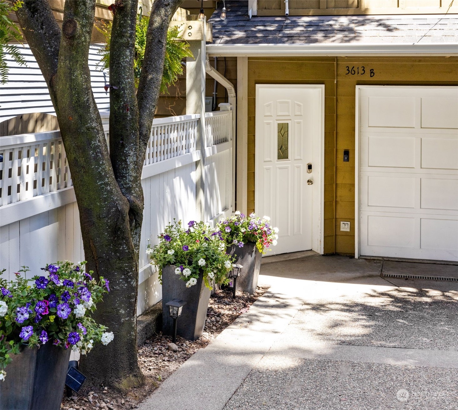 3613 22nd Avenue West, Unit B Seattle, WA 98199 - Photo 1 of 35 a front view of a house