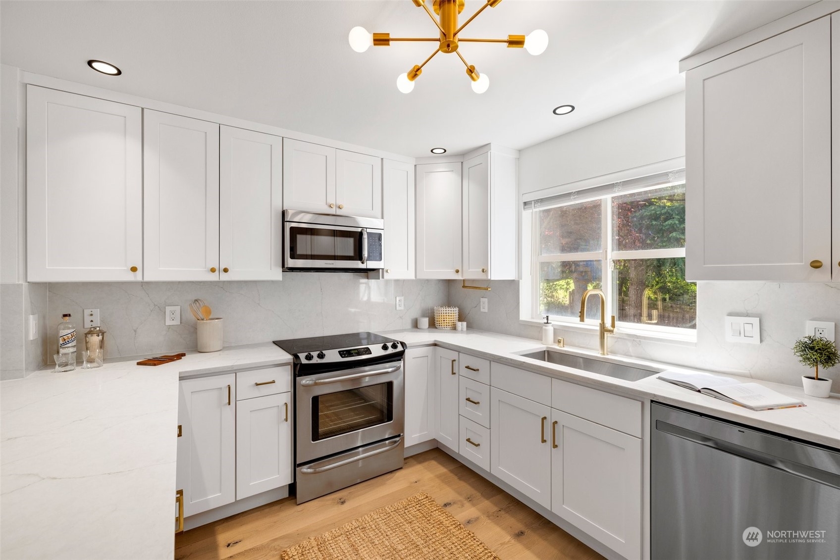 3613 22nd Avenue West, Unit B Seattle, WA 98199 - Photo 14 of 35 a kitchen with a sink stove and microwave