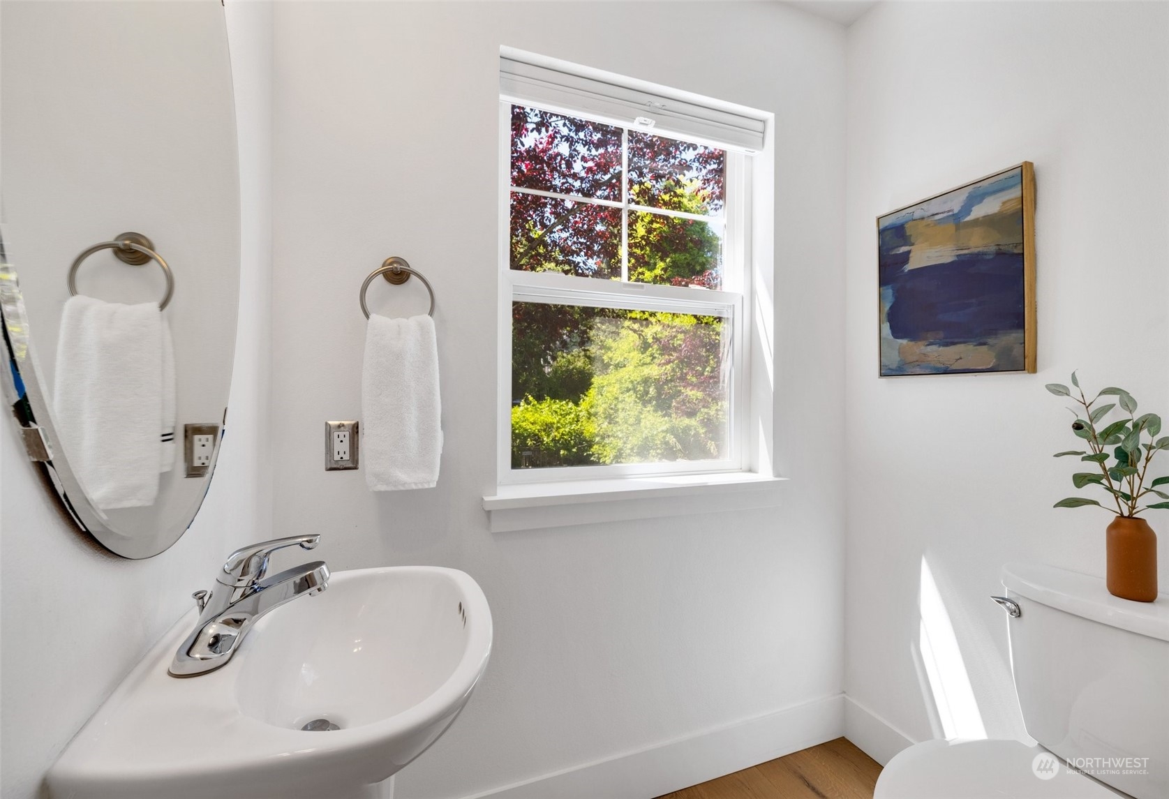 3613 22nd Avenue West, Unit B Seattle, WA 98199 - Photo 16 of 35 a bathroom with a toilet a sink and mirror