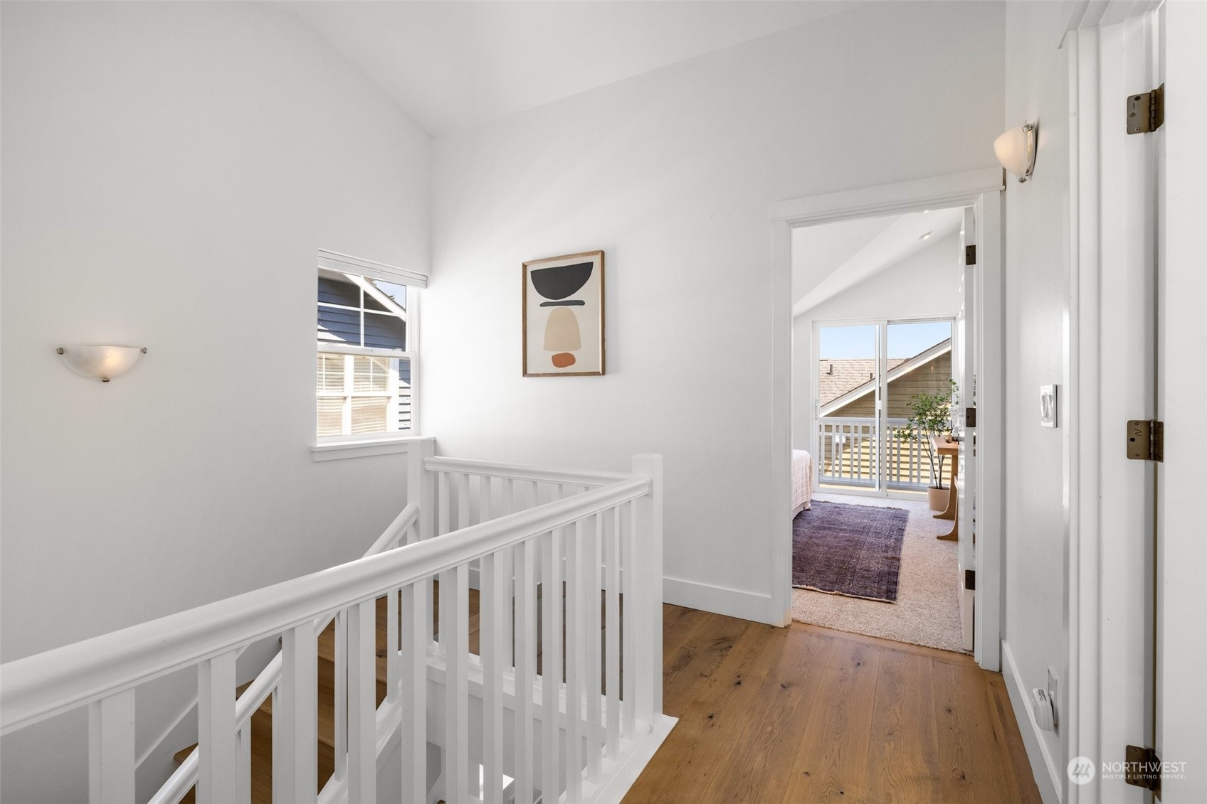 3613 22nd Avenue West, Unit B Seattle, WA 98199 - Photo 18 of 35 a view of hallway with window and wooden floor