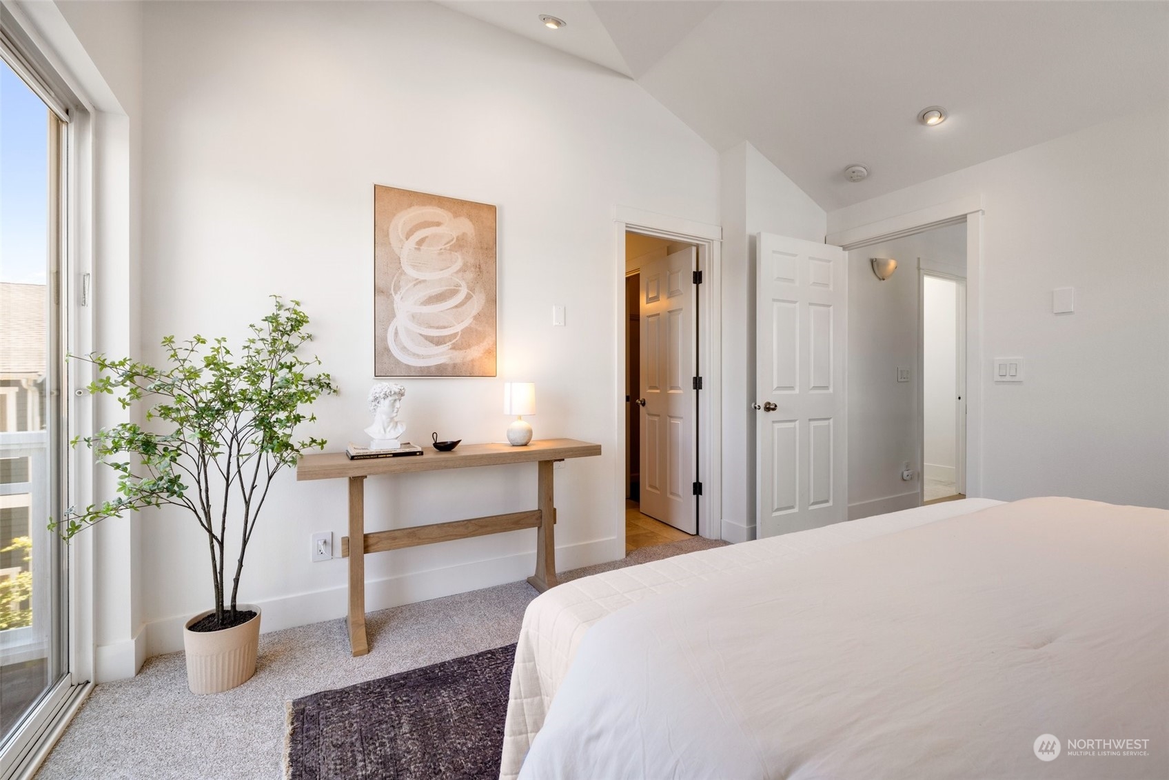 3613 22nd Avenue West, Unit B Seattle, WA 98199 - Photo 21 of 35 a bedroom with a bed and a potted plant