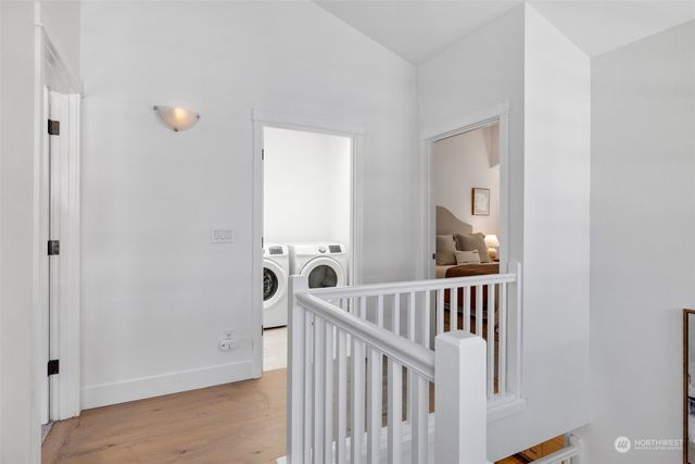 a view of a room with furniture and wooden floor