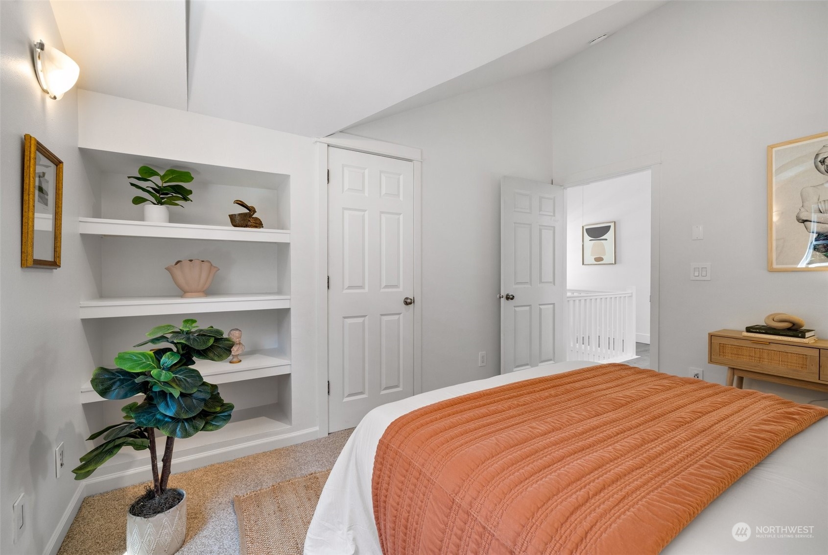 3613 22nd Avenue West, Unit B Seattle, WA 98199 - Photo 25 of 35 a bedroom with a bed and a potted plant