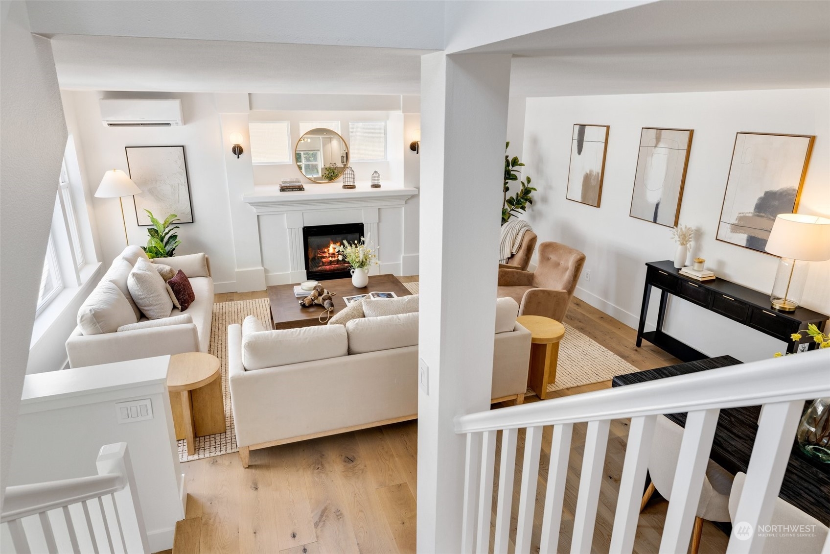 3613 22nd Avenue West, Unit B Seattle, WA 98199 - Photo 27 of 35 a living room with furniture and a fireplace