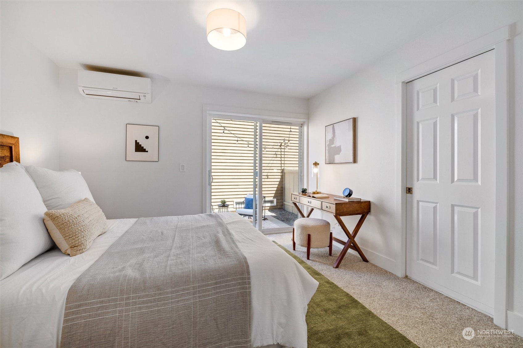 3613 22nd Avenue West, Unit B Seattle, WA 98199 - Photo 29 of 35 a bedroom with a bed and a window