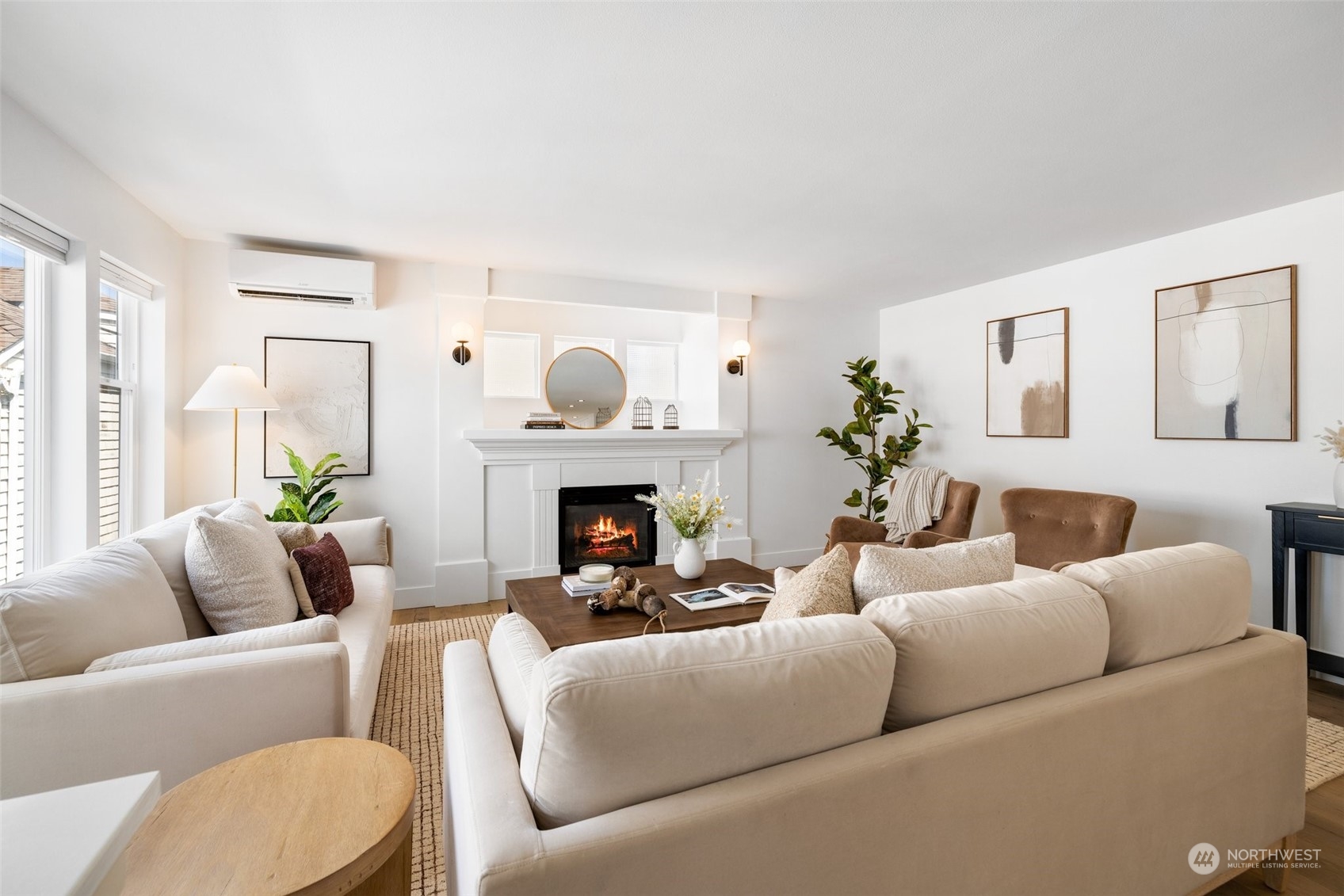3613 22nd Avenue West, Unit B Seattle, WA 98199 - Photo 6 of 35 a living room with furniture a fireplace and a large window