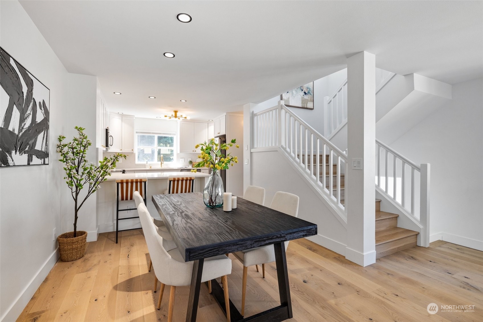 3613 22nd Avenue West, Unit B Seattle, WA 98199 - Photo 10 of 35 a view of a dining room with furniture and wooden floor
