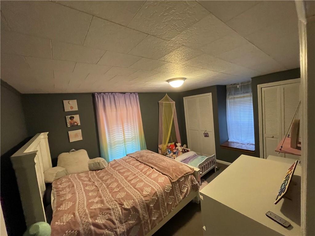 30 Fisher Street Commodore, PA 15729 - Photo 12 of 13 a bed sitting in a bedroom next to a window