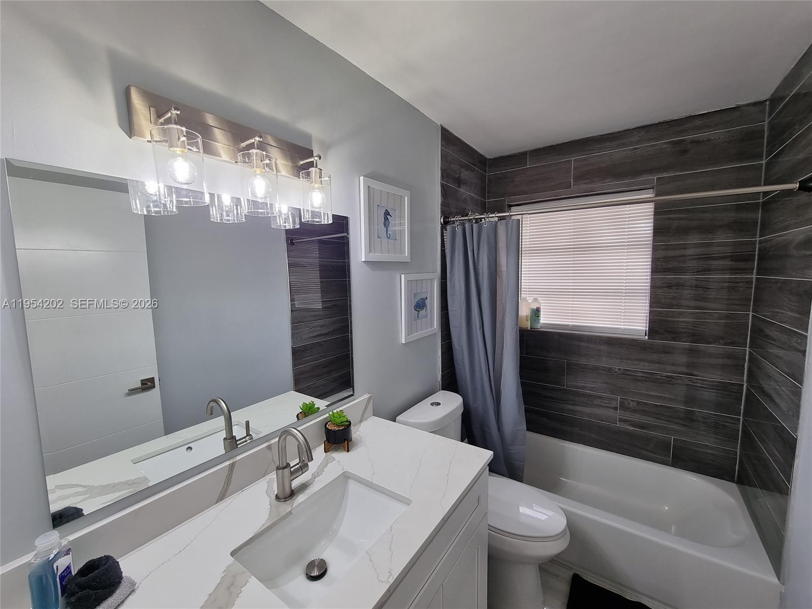 4740 Southwest 43rd Avenue Dania Beach, FL 33314 - Photo 21 of 23 renovated bathroom with tub