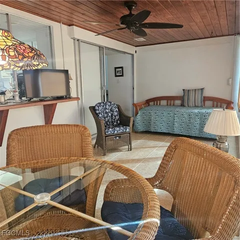 a view of a house with backyard porch and sitting area