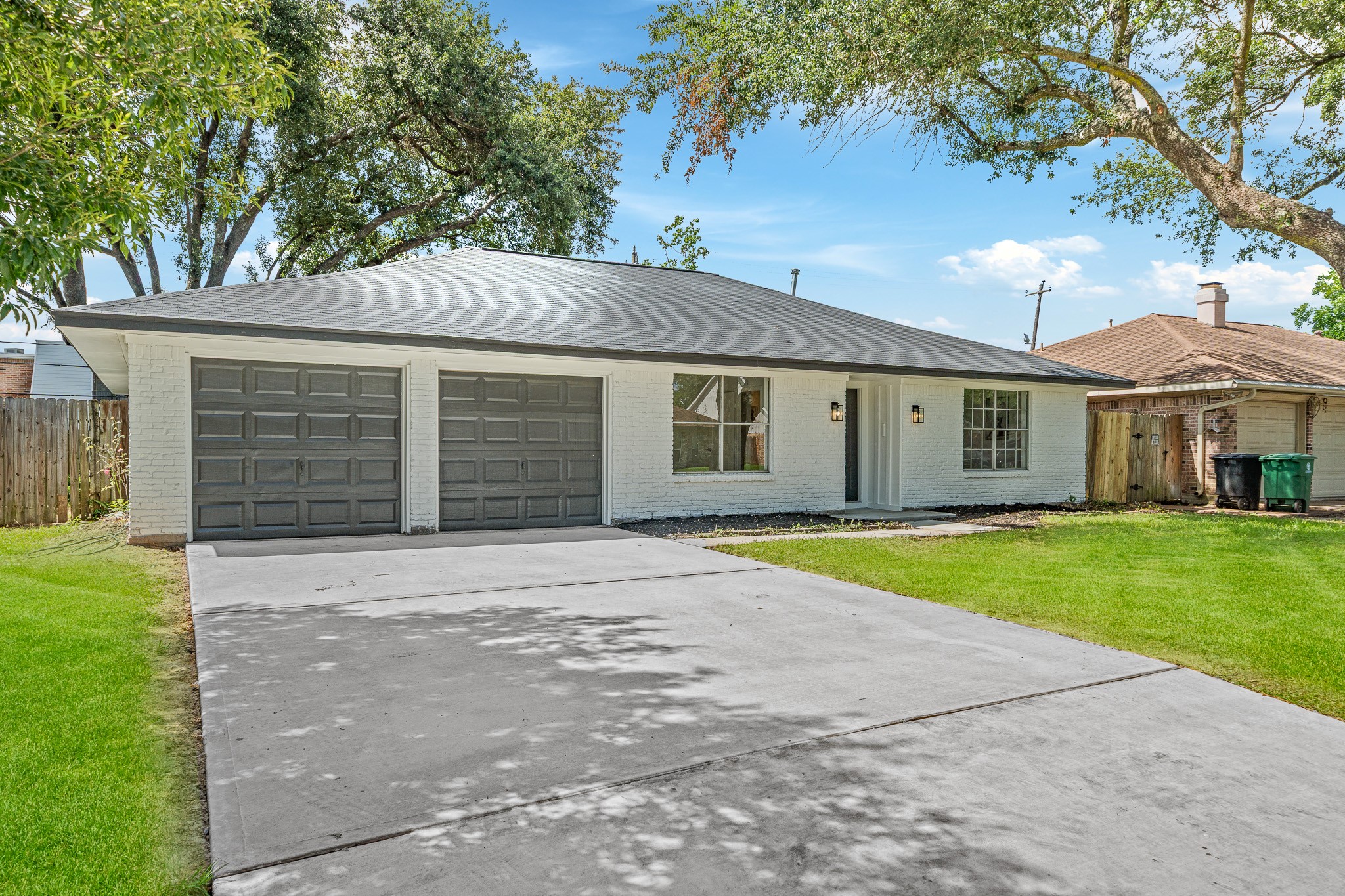 111 Princess Drive Houston, TX 77034 - Photo 1 of 30 a front view of a house with a yard and garage